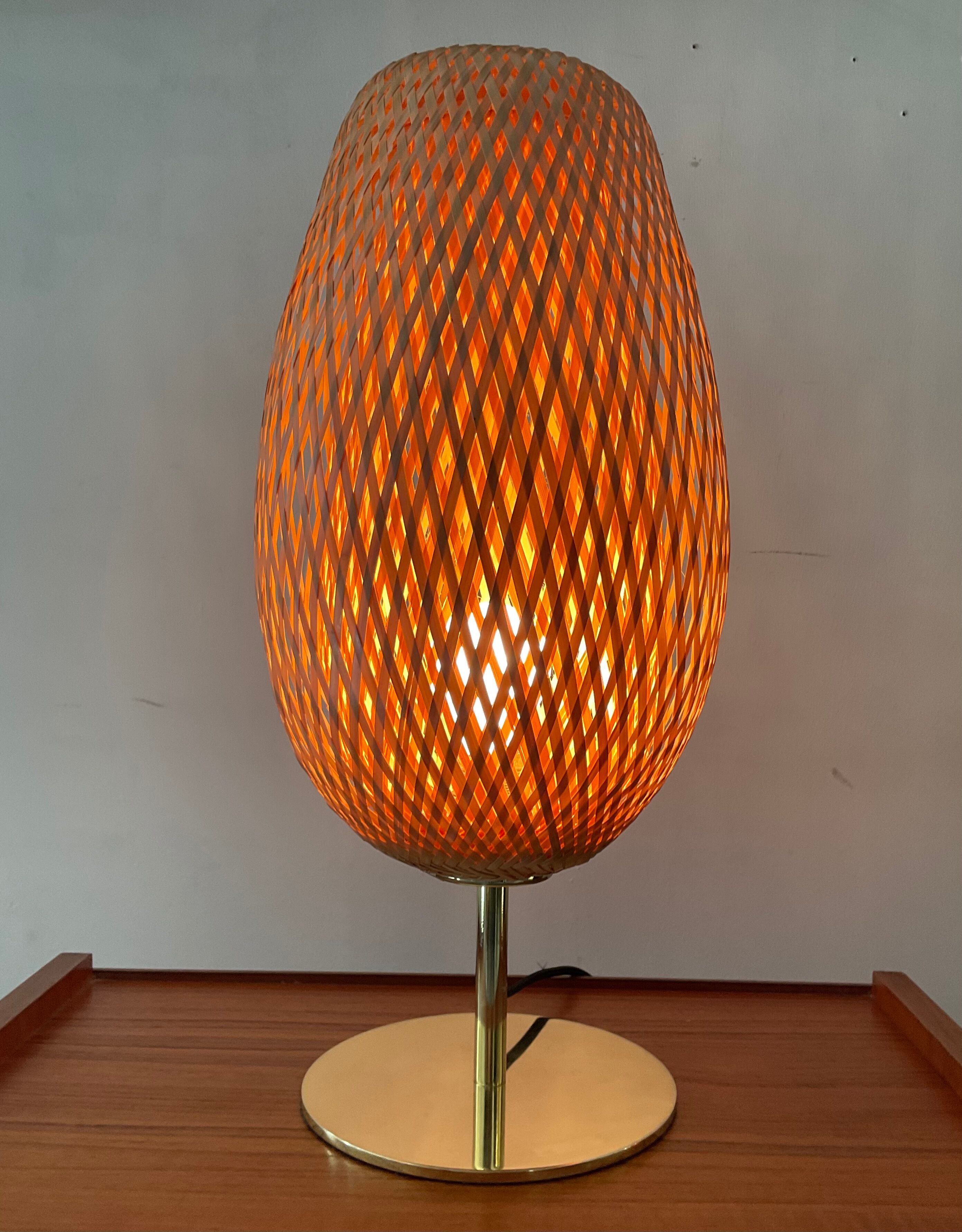 Design lamp in gold metal and wicker