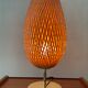 Design lamp in gold metal and wicker