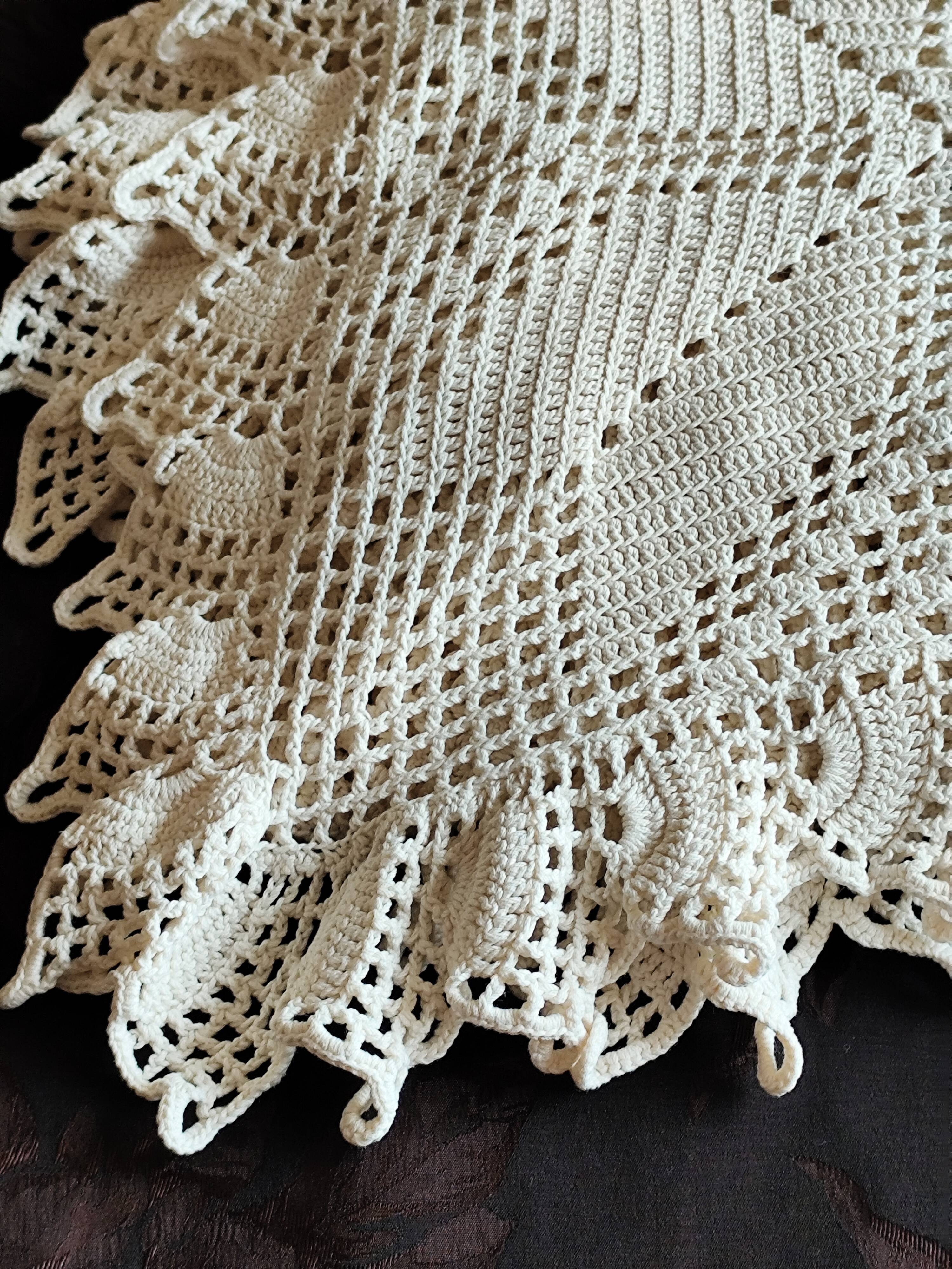 White cotton bedspread, crocheted sofa throw with star patterns
