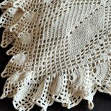 White cotton bedspread, crocheted sofa throw with star patterns