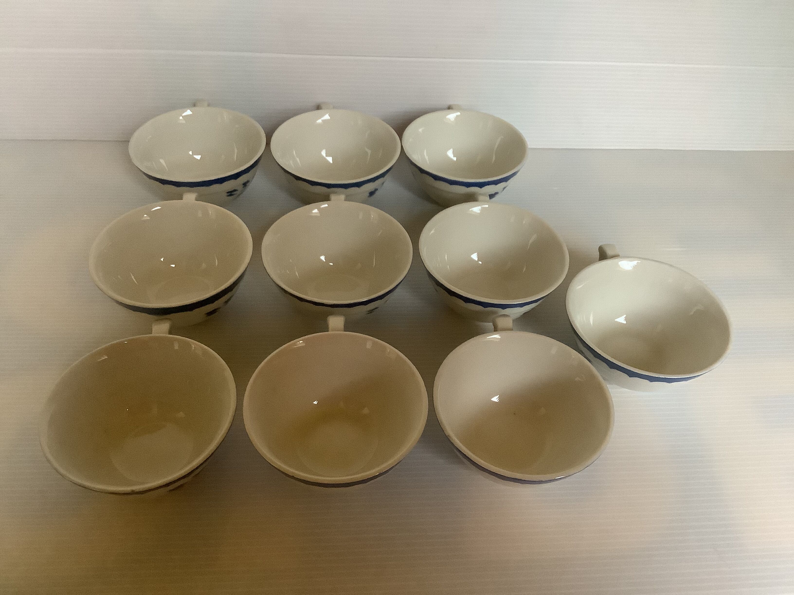 10 old earthenware cups with blue flowers and stencils