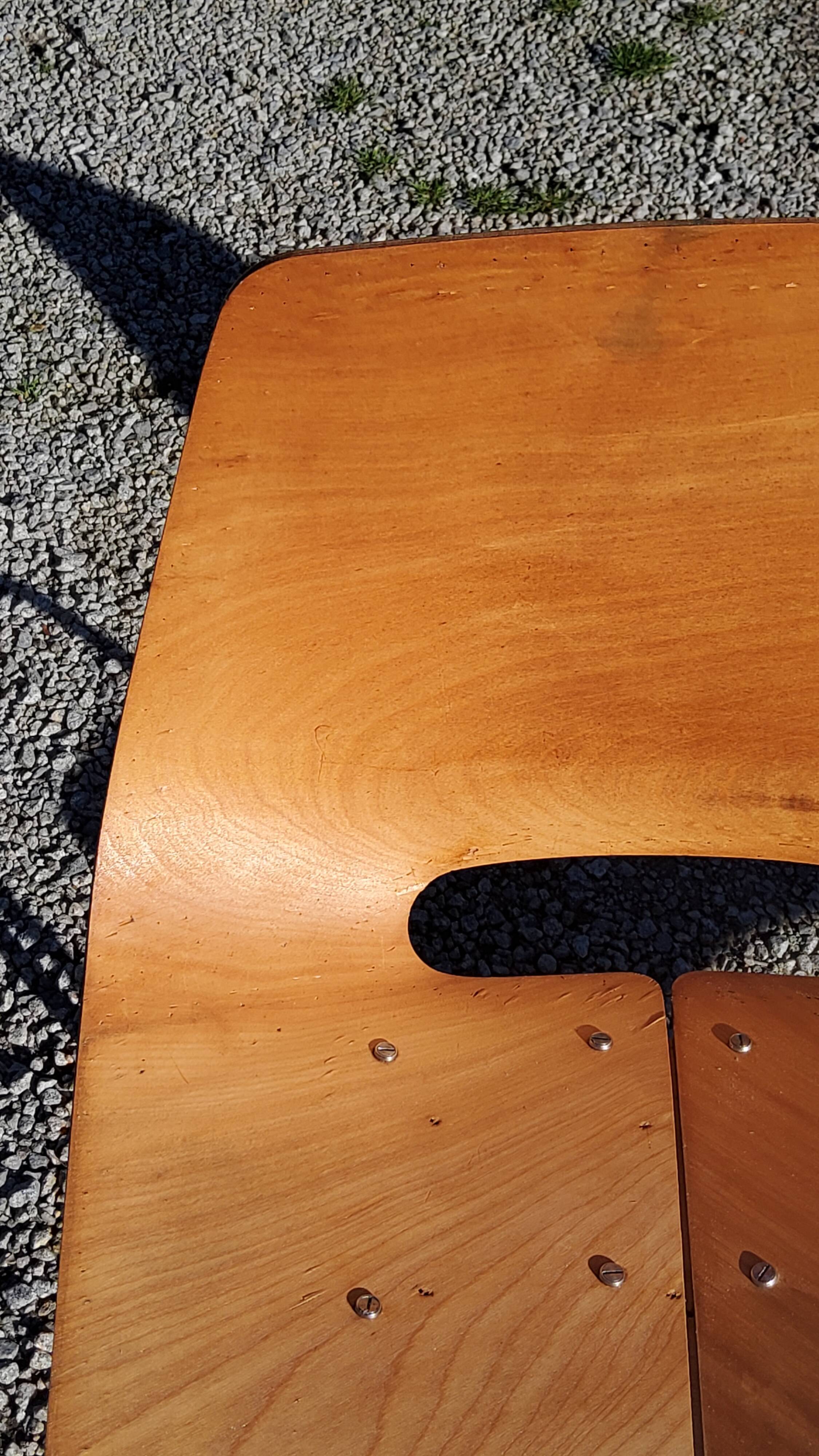 Pair of tonneau chairs by Pierre Guariche plywood base tubes 1954