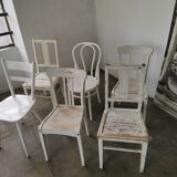 Set of 6 mismatched white chairs