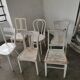 Set of 6 mismatched white chairs