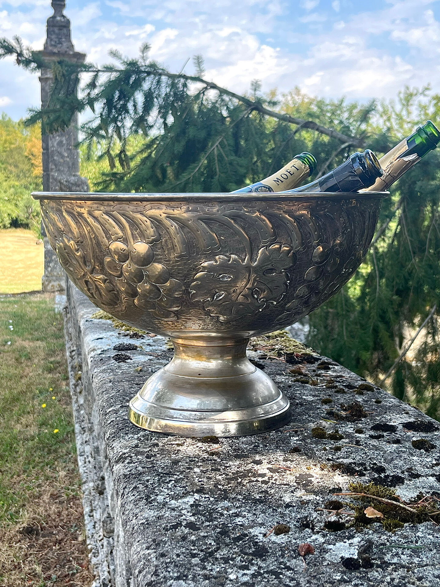 Large silver plated champagne cooler bowl on pedestal with grape