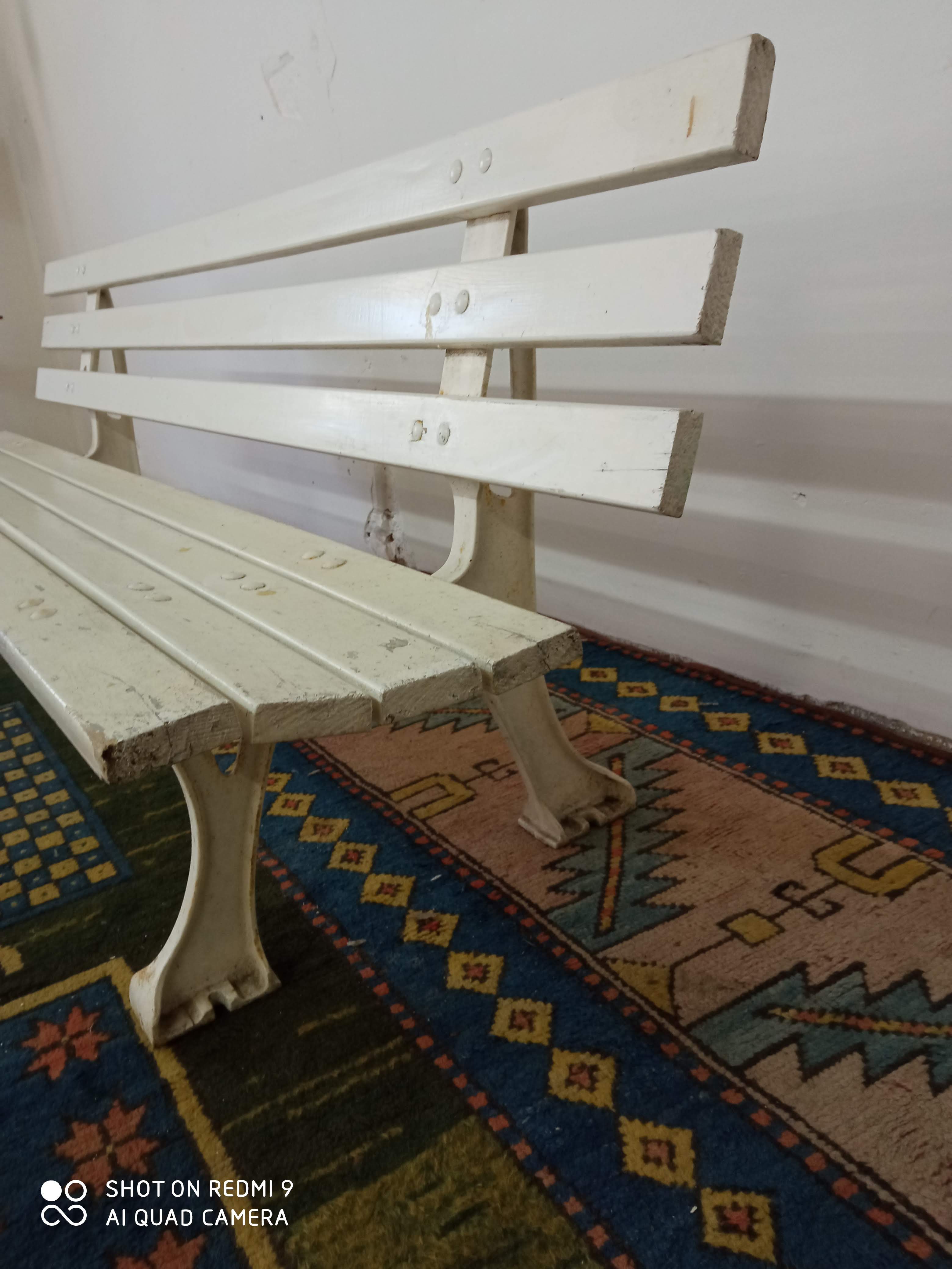 Wooden garden bench and old cast iron