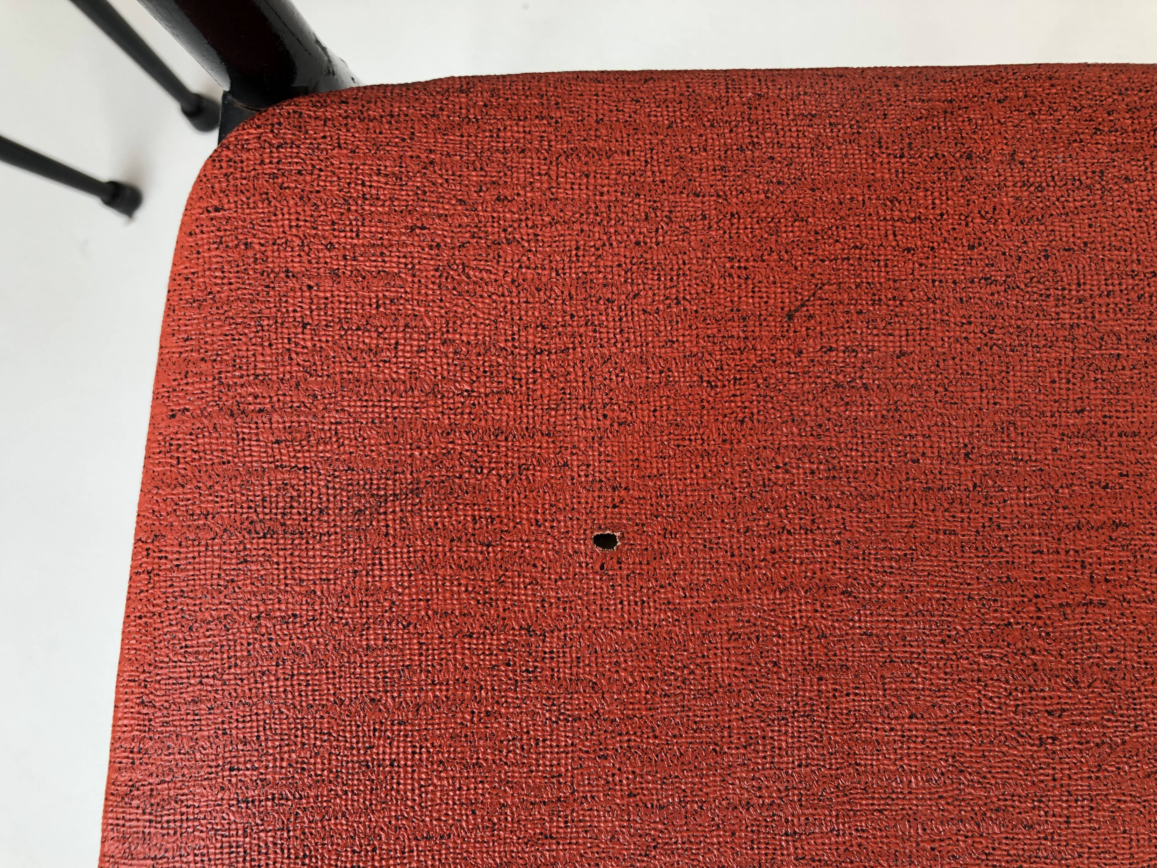 Red metal chairs from the 60s