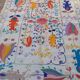 White suzani kilim rug with embroidered colorful patterns