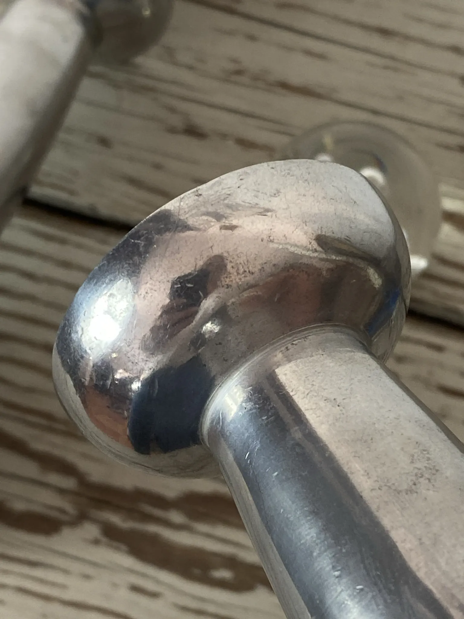 Pair of minimalist polished aluminium candle holders
