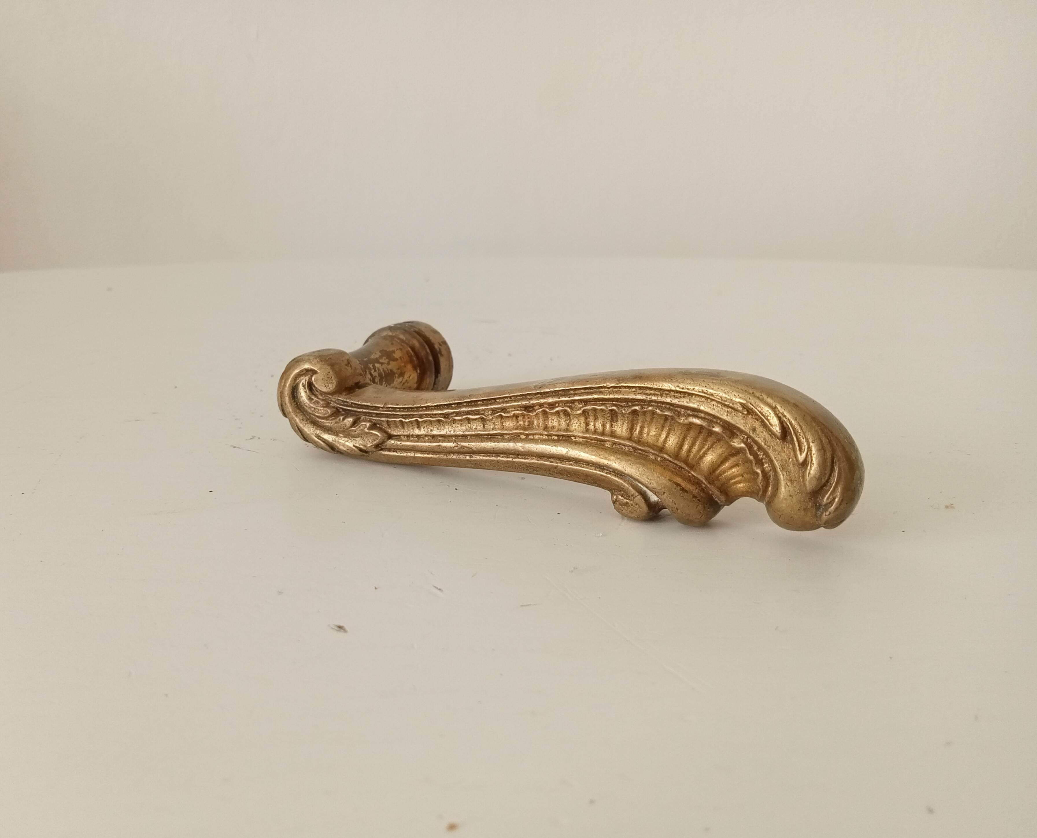 Antique bronze door handle in Empire style