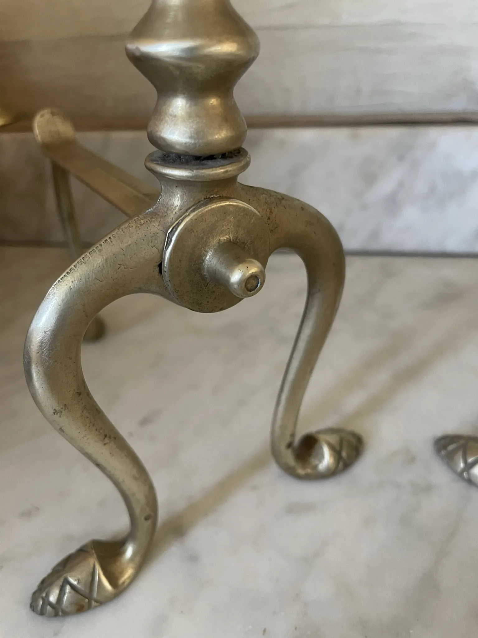 Pair of Victorian brass fire dogs from the late 19th century.