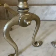 Pair of Victorian brass fire dogs from the late 19th century.