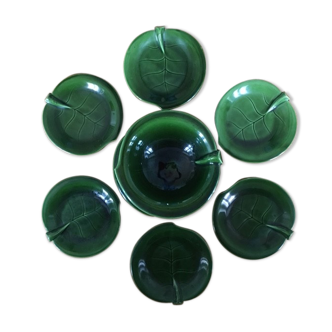 Lot of dishware leaves in green dabbling