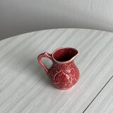Red ceramic milk jug