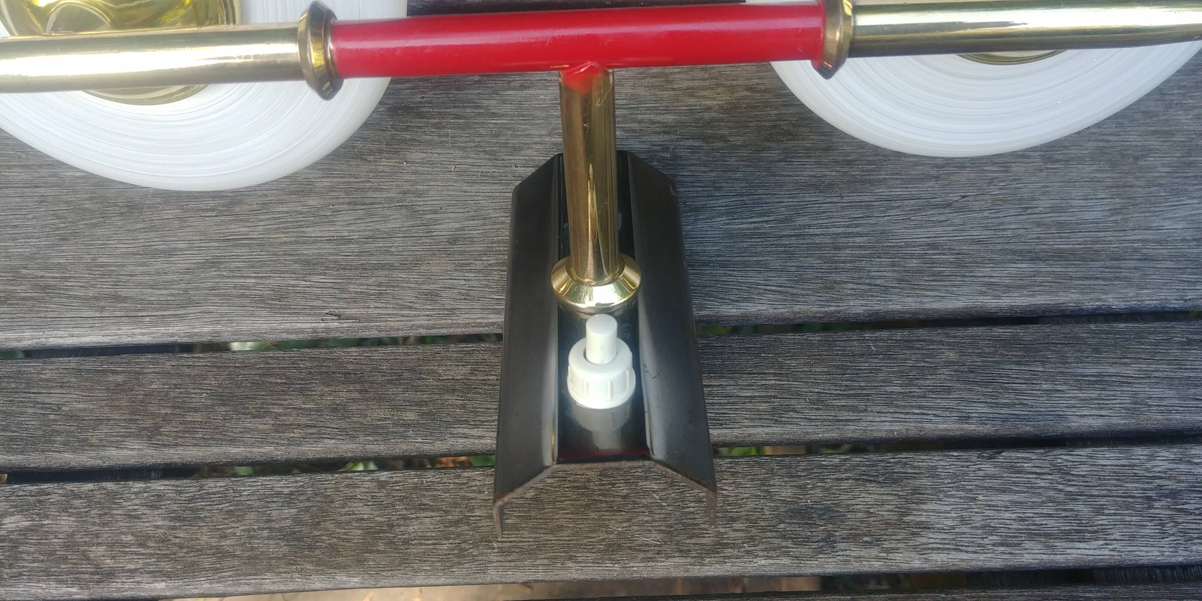 Vintage wall light from the 40s/50s with its two glass sconces on a brass support