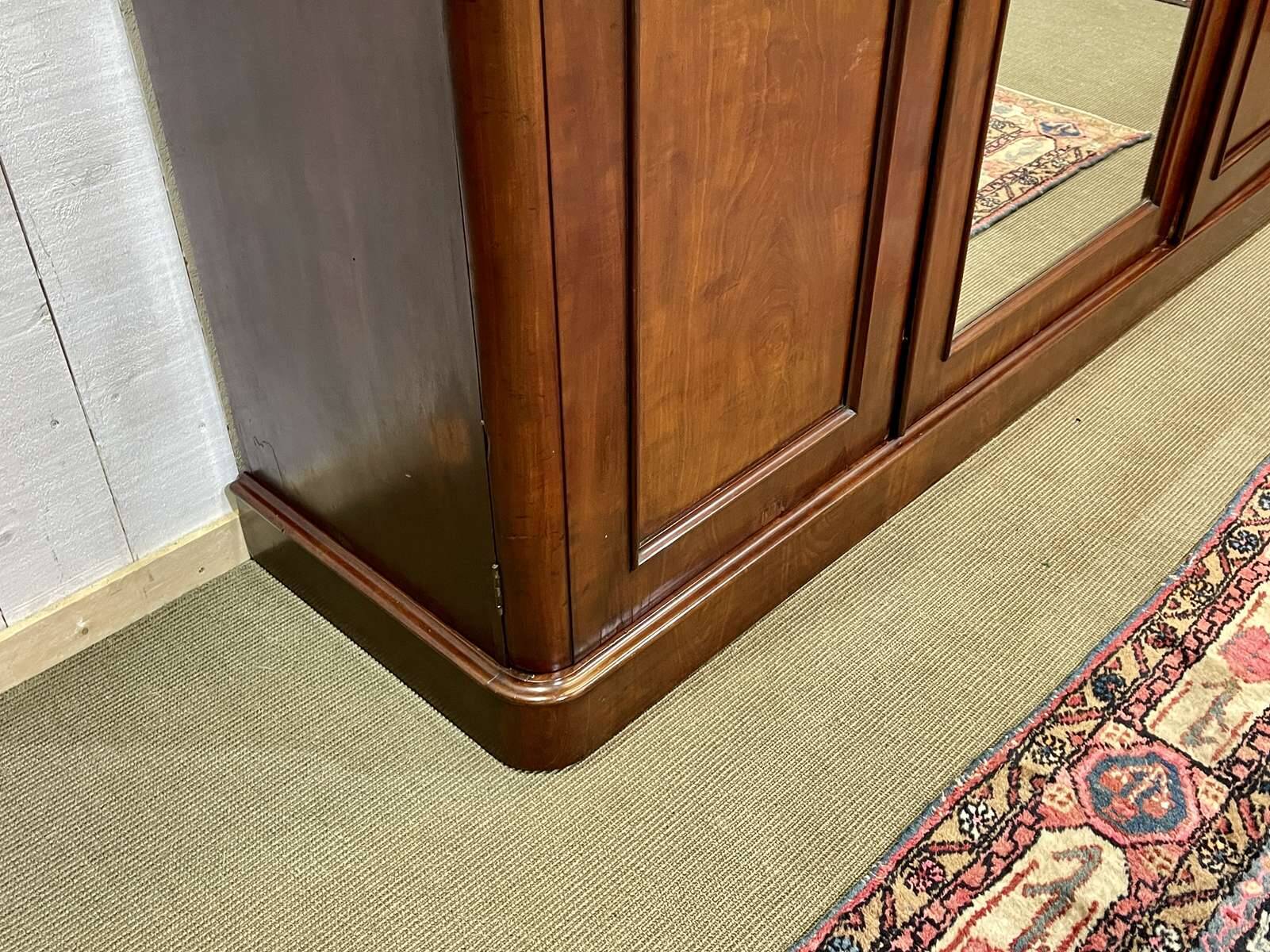 19th-century Victorian English bedroom wardrobe in mahogany.