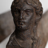 Pair of ancient cast iron chenets adorned with bust of Marianne