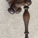 Wall-mounted accordion coat rack made of turned wood