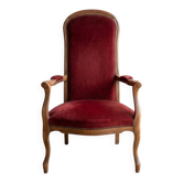Louis XV style Voltaire armchair in wood and burgundy fabric.