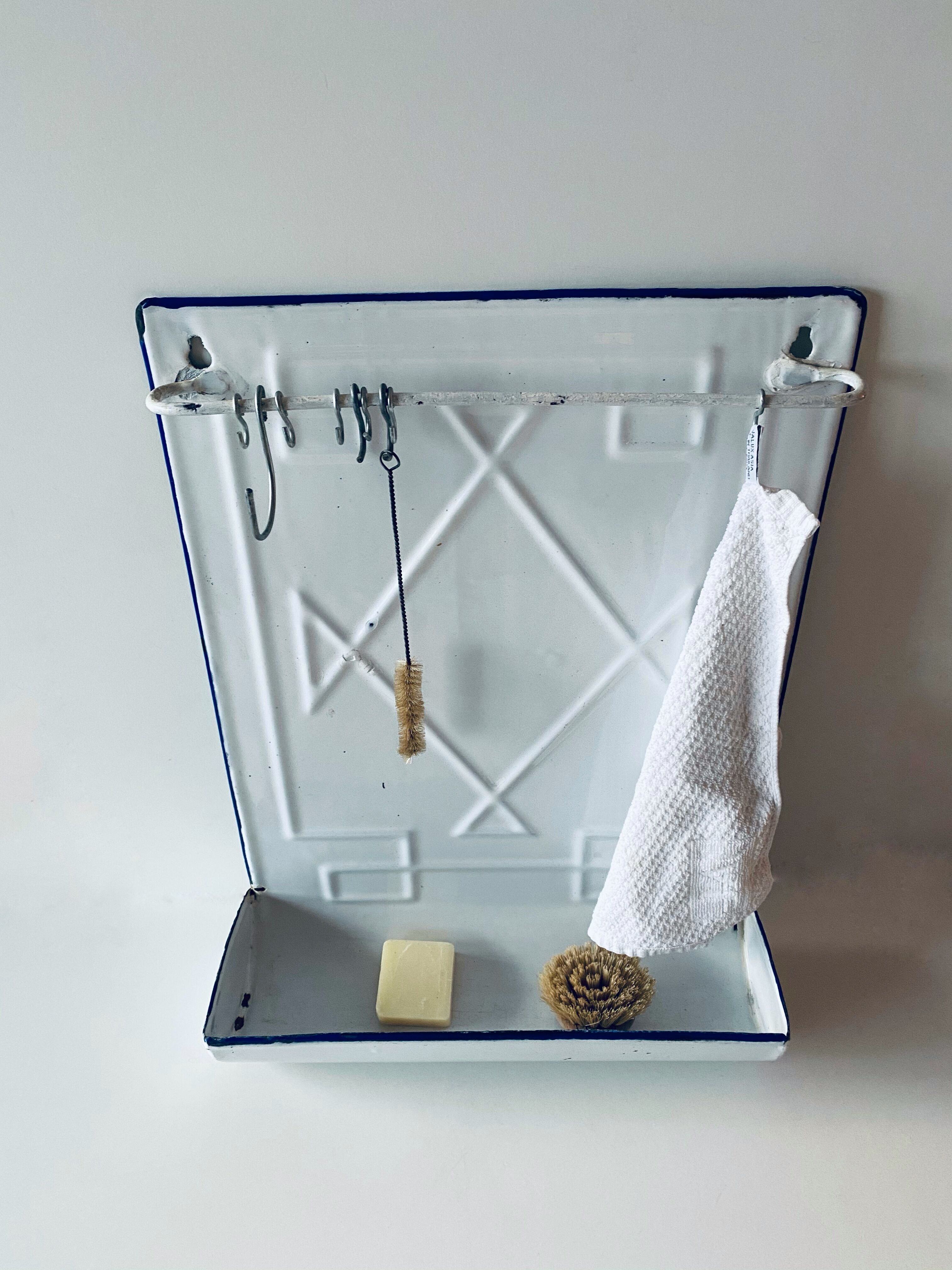 Old enamelled kitchen utensil display