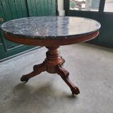 Round pedestal table with marble top and mahogany tripod from the 19th century