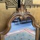 In-between mirror in gilded wood