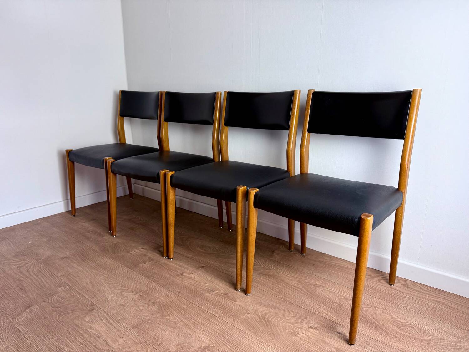 Set of 4 wooden and black leatherette chairs