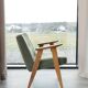 Vintage olive green bouclé armchair model 366
