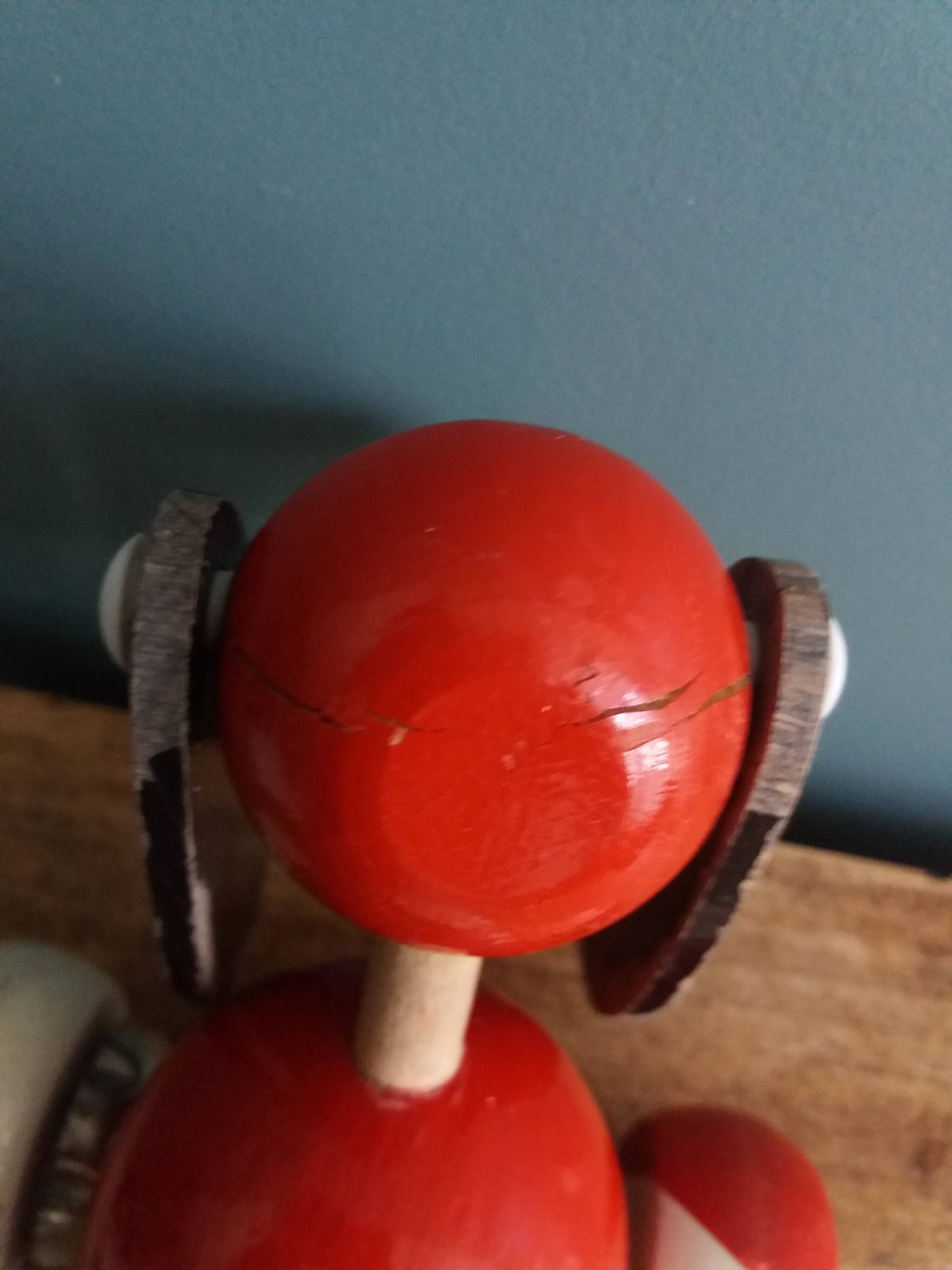 Lacquered wooden pull-along dog toy