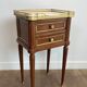 Pair of mahogany and brass side tables or bedside tables with Carrara marble tops.