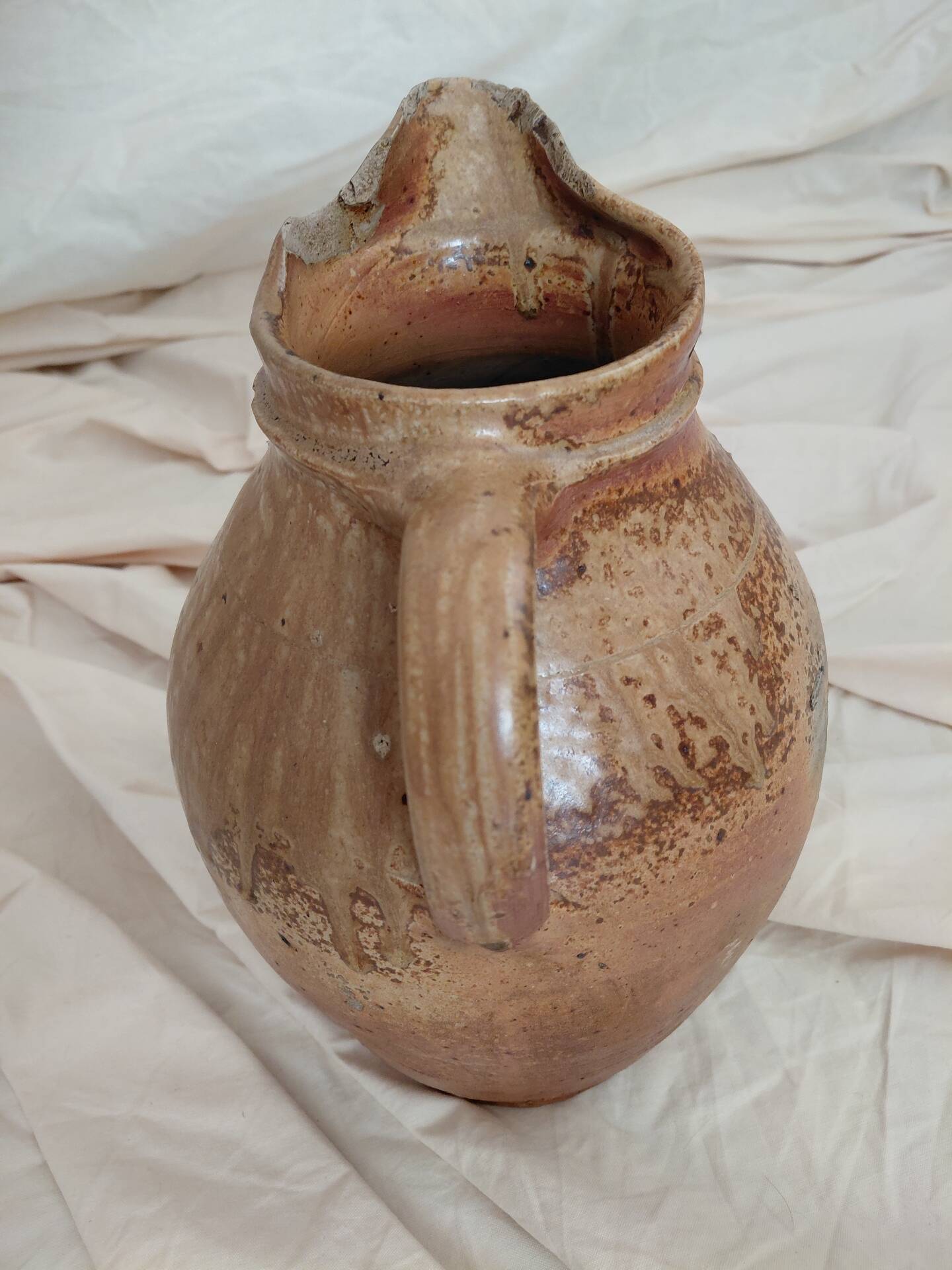 Old farm jug in glazed stoneware