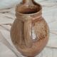 Old farm jug in glazed stoneware