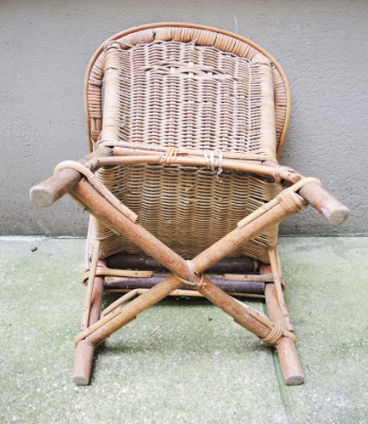 Desk with rattan and wicker armchair for children