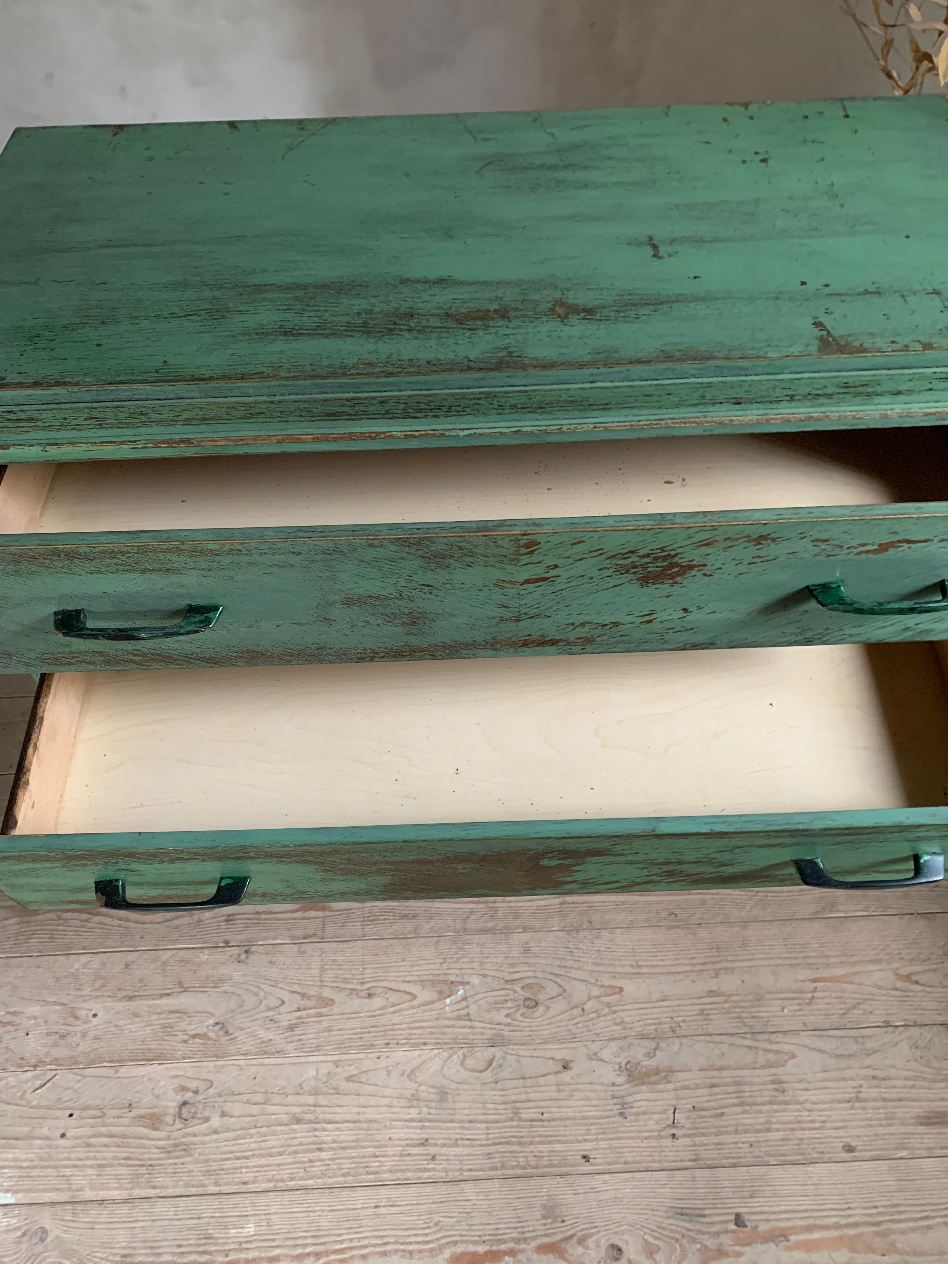 Vintage compass leg commode with a patina.