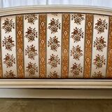 Louis XVI style bed in patinated wood with fluted columns.