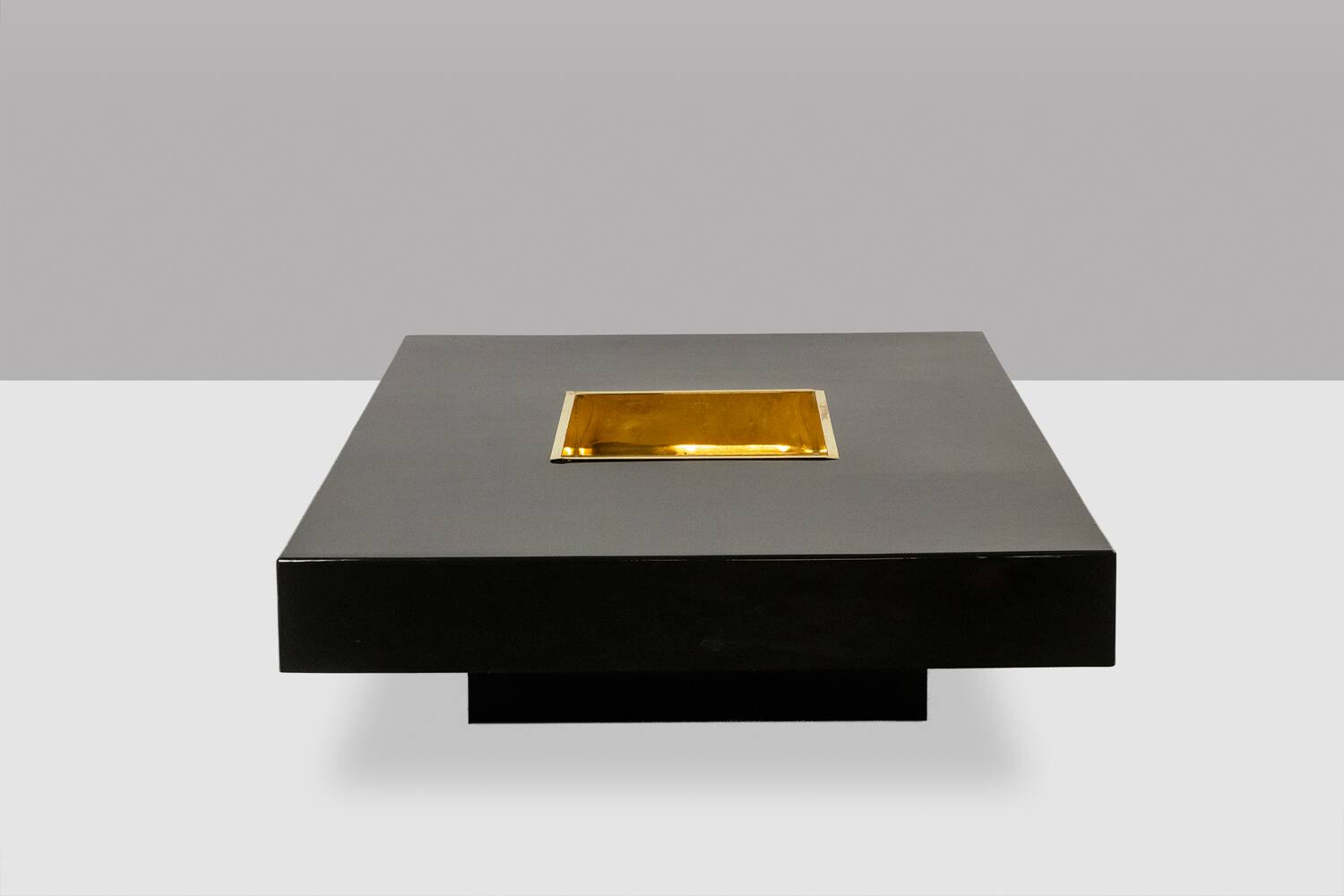 Willy Rizzo. Low table in black lacquered wood and gold brass. 1970s.
