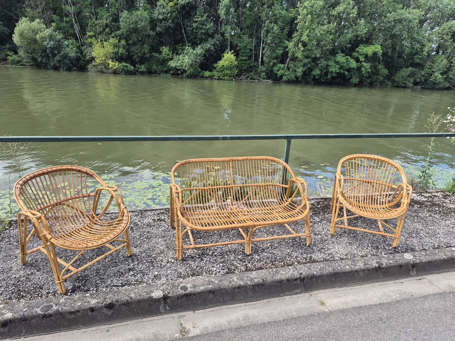 Rattan lounge with two armchairs and a vintage 1950s bench.