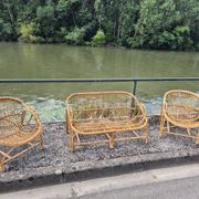 Rattan lounge with two armchairs and a vintage 1950s bench.