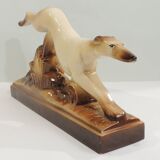 Beige and brown ceramic representing a “Greyhound/vintage 1930