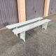 Pair of wooden benches painted white, French artisanal work.