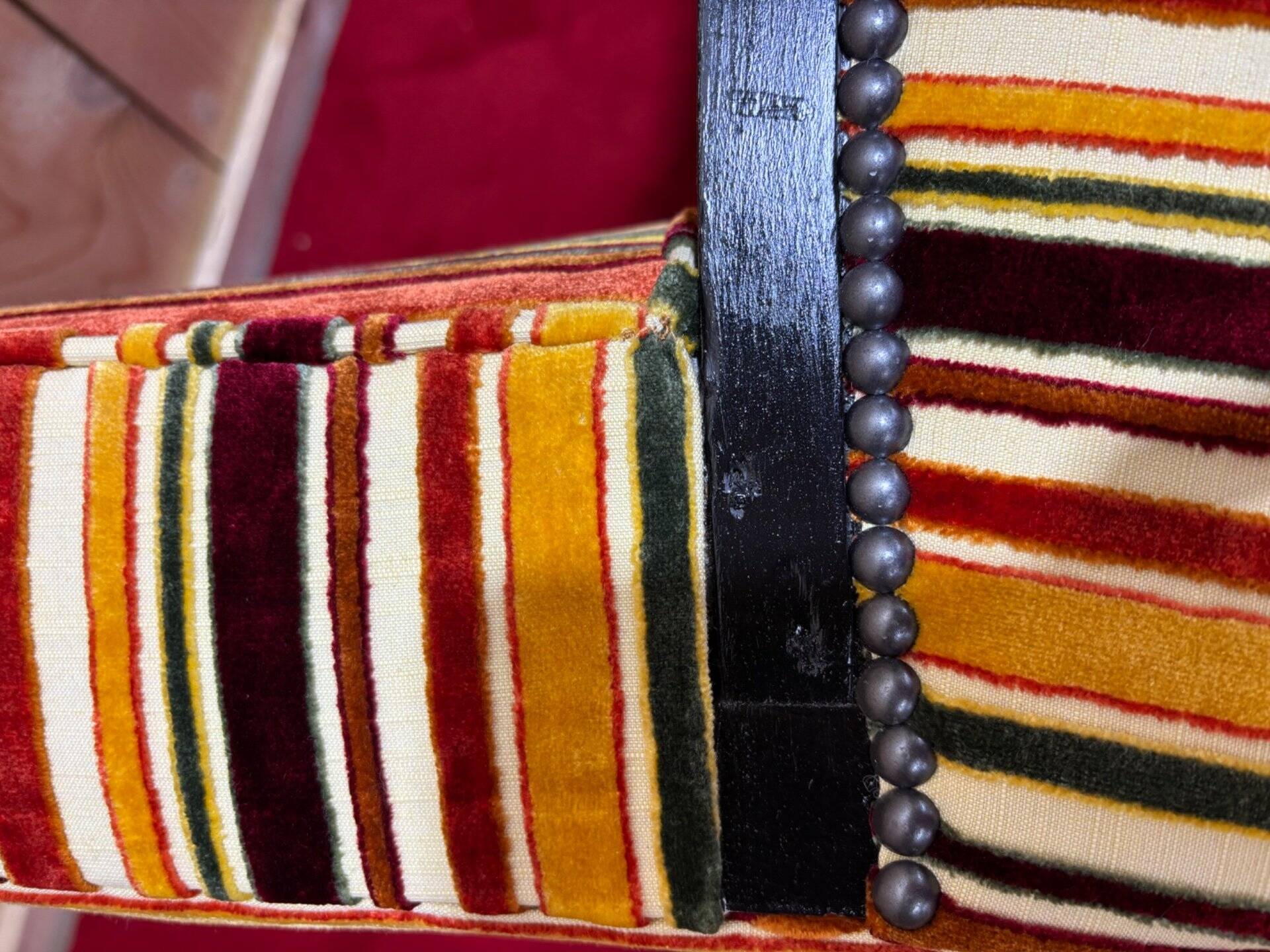 Art Deco armchair in multicolored striped fabric and its footrest