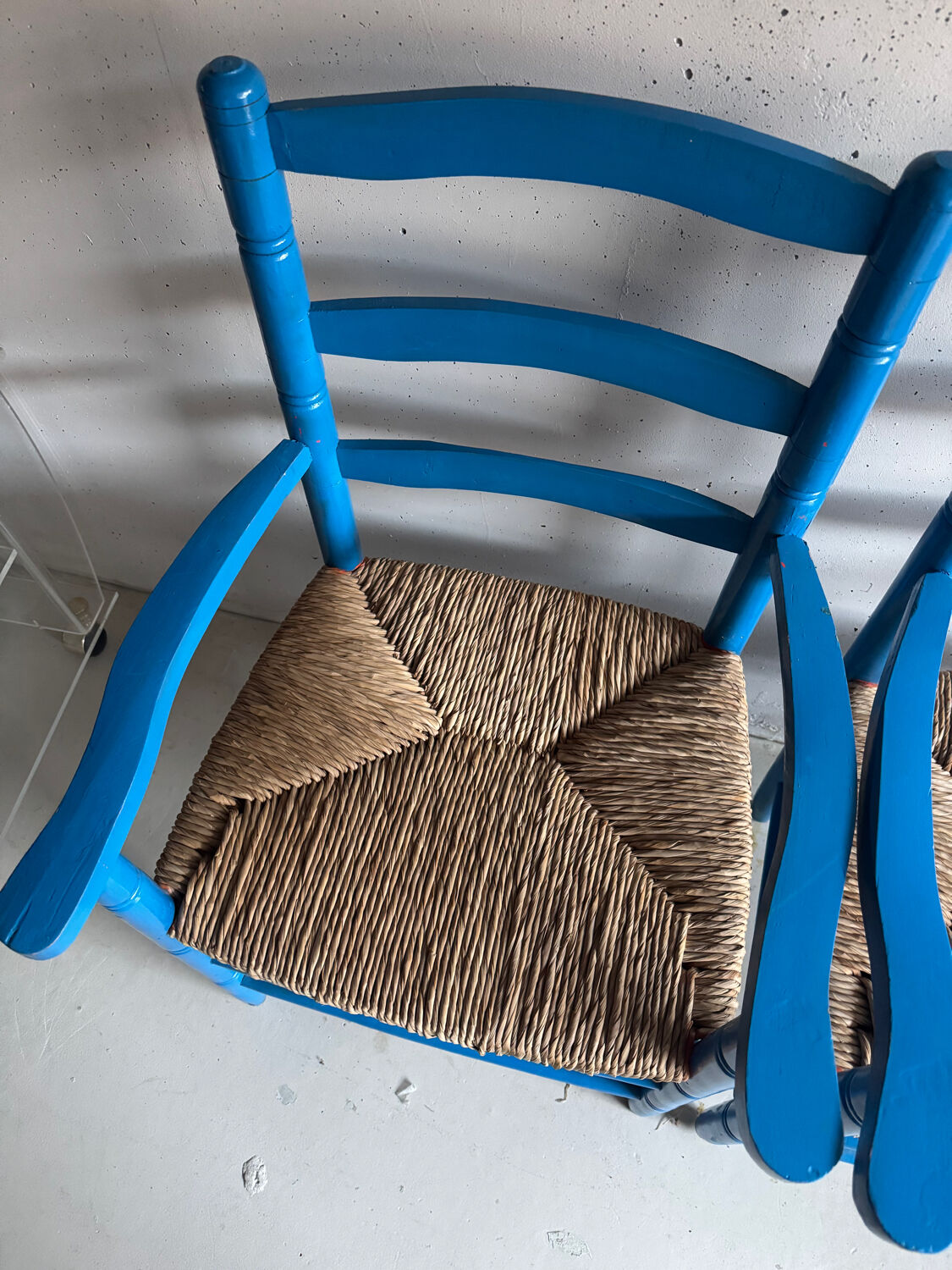 Pair of Provençal armchairs in painted wood and straw, around 1960.