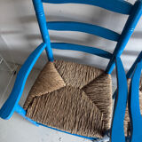 Pair of Provençal armchairs in painted wood and straw, around 1960.