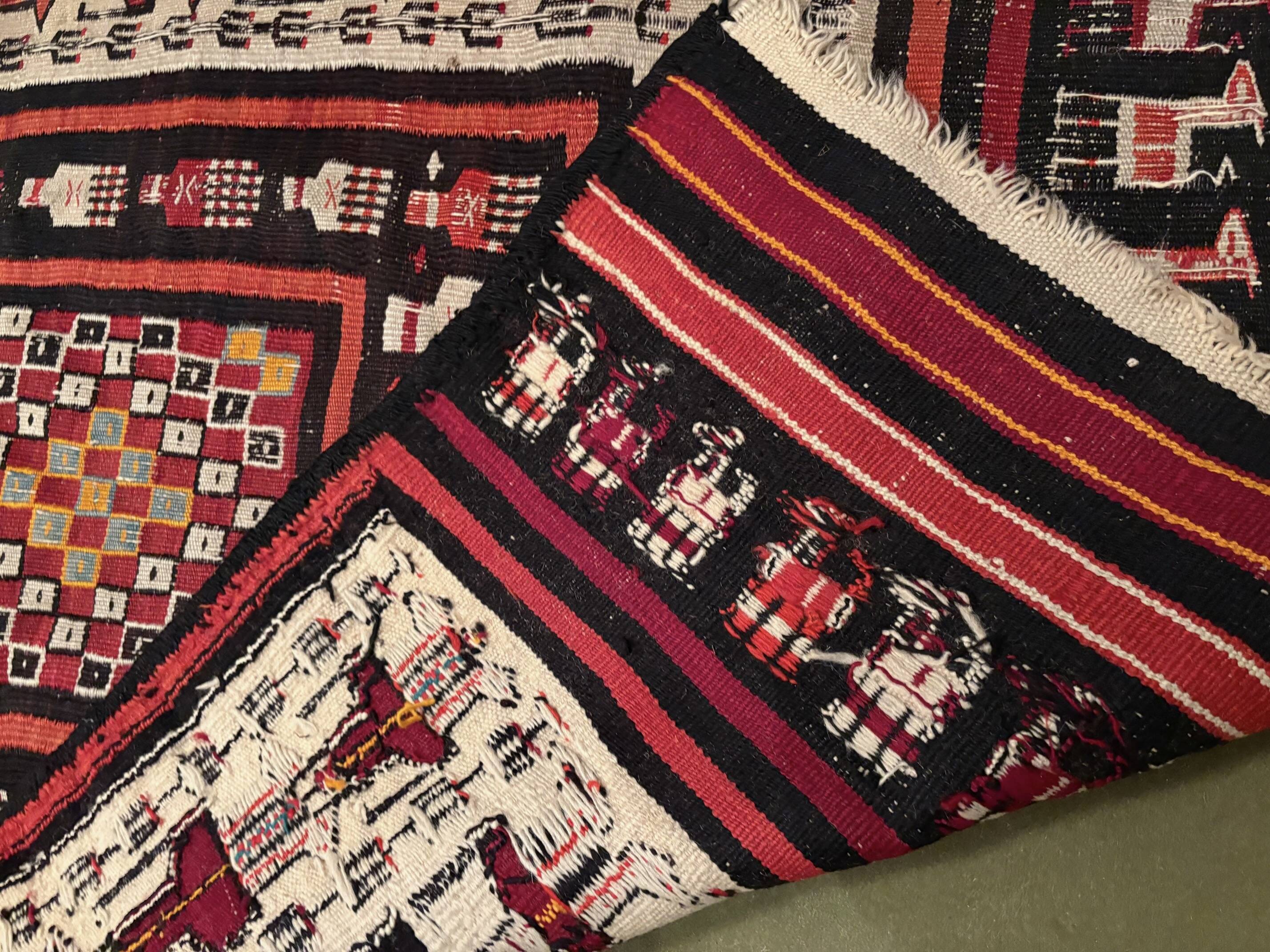 Rectangular folk rug from North Africa with a dominant red colour, 1970s.