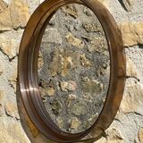Vintage round smoked plastic mirror, circa 1970s.