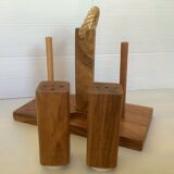 Six salt and pepper cherry-makers with their support