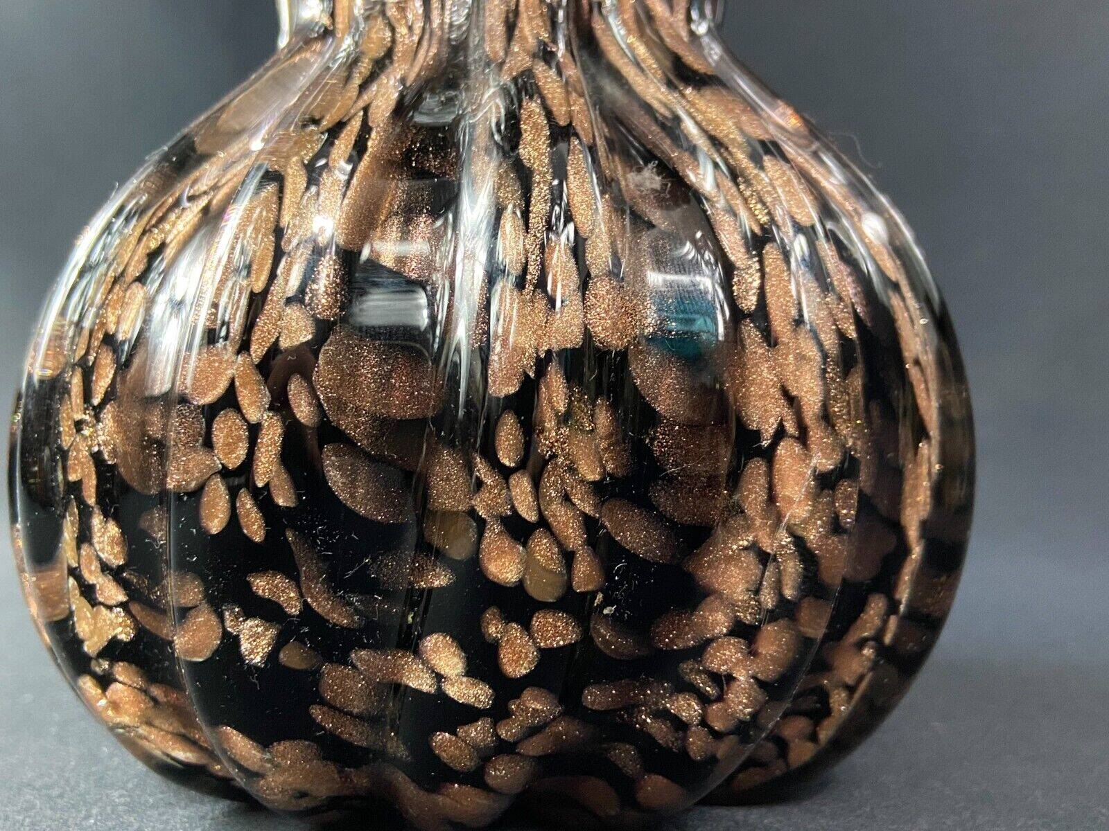Vase signed in Murano Venice crystal with gold inclusion on a black background