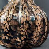Vase signed in Murano Venice crystal with gold inclusion on a black background