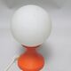 Small 1970s orange tulip-shaped ball lamp on a stand