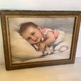 Old frame with a baby